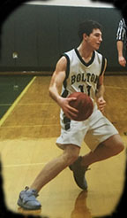 basketball player crossing over the ball
